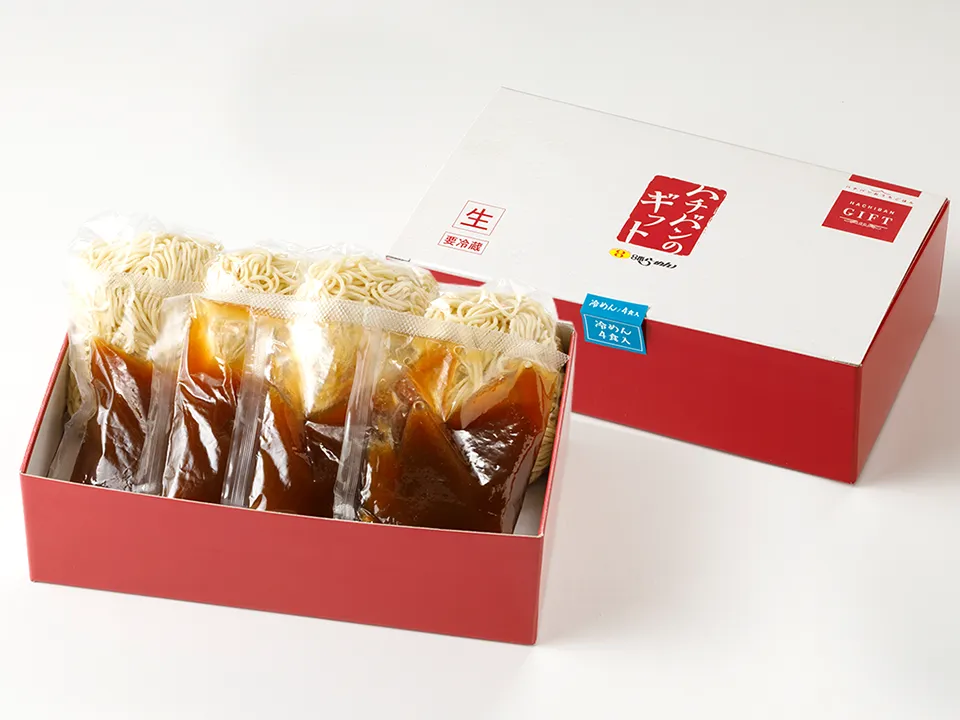 冷めんの箱の画像。外箱と、蓋が開いてセット内容がわかる写真。